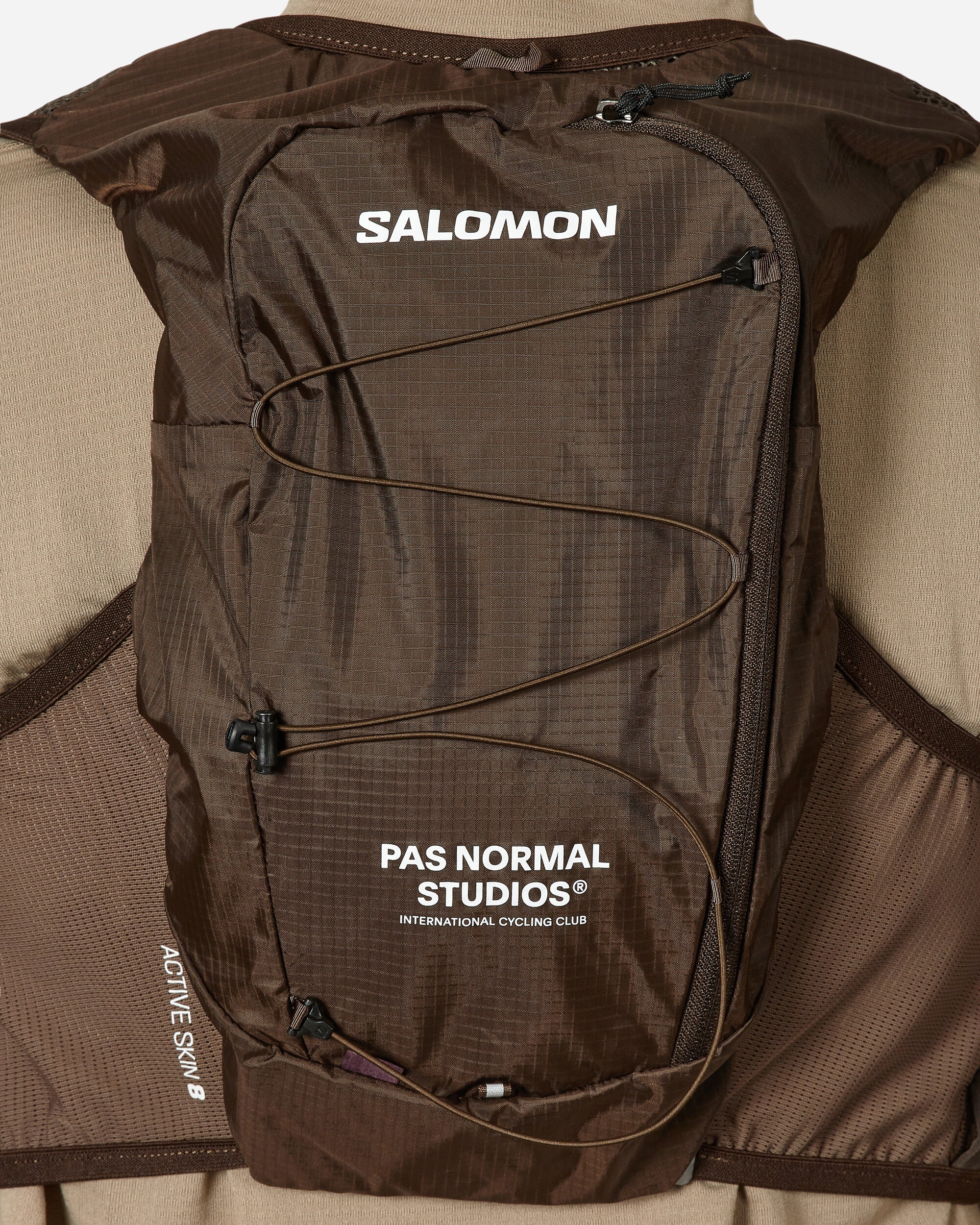 Salomon Active Skin 8 Pas Normal Studios Balck Coffee/Delicioso Coats and Jackets Vests LC2089000